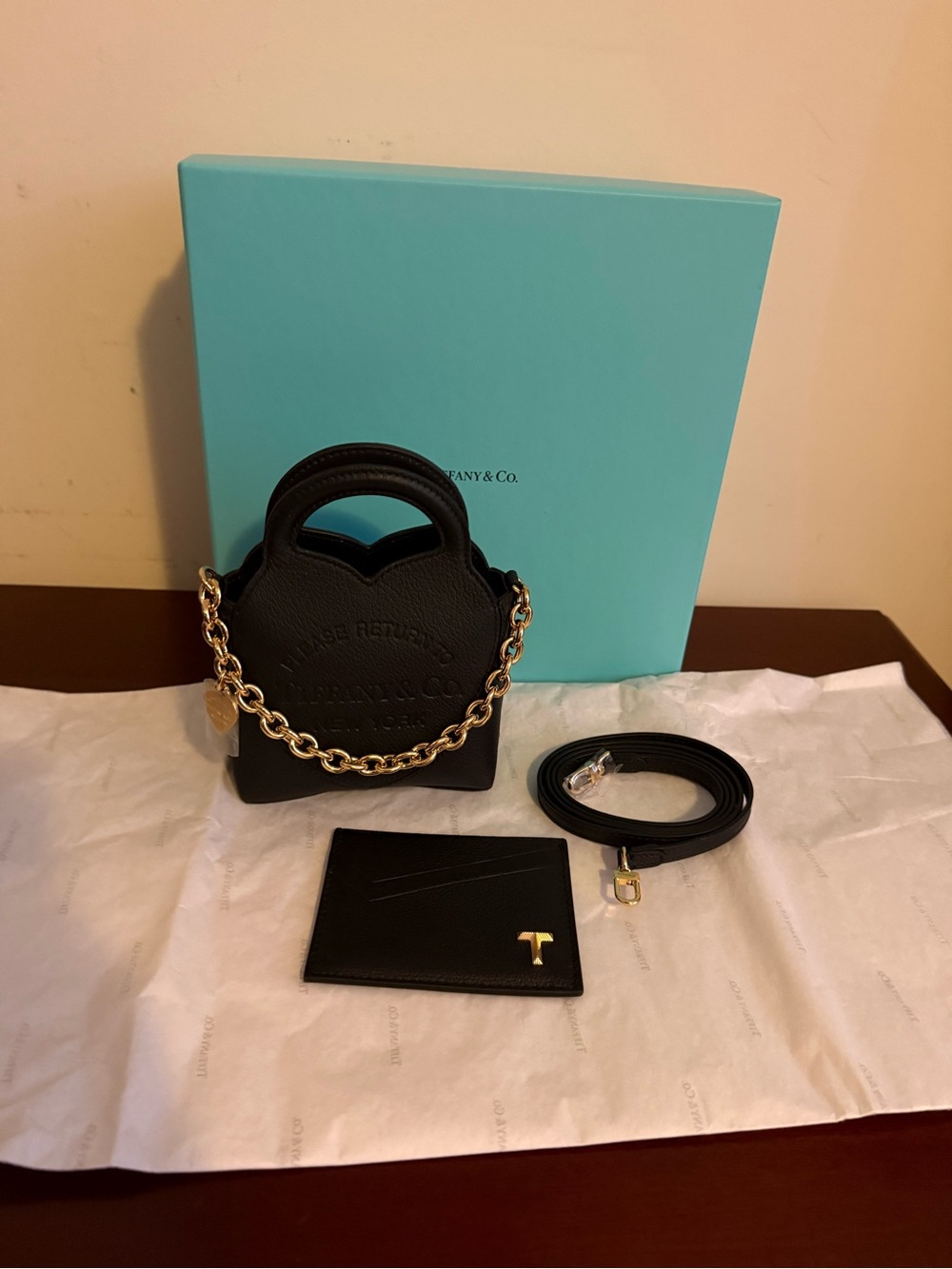 Tiffany & Co. Black Leather Mini Bag with Gold Chain Accent
